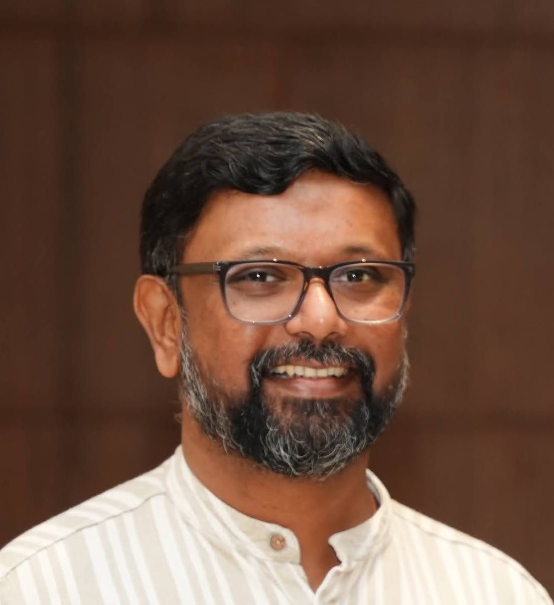 Dr. Arul George Scaria